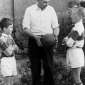 1955 Captain John Dowling gives football tips to his young cousins Kieran and Brian