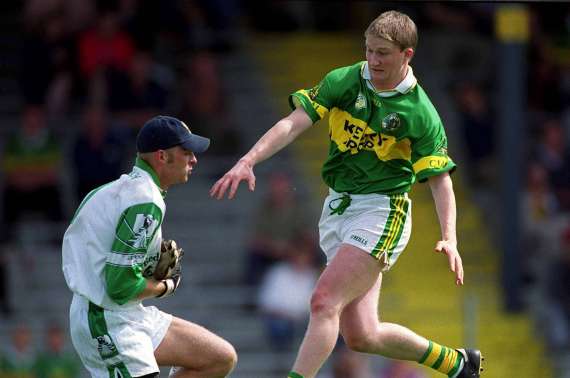 Mike Frank Russell challenges Limerick goalkeeper Alan Kitson in the 2001 Munster SFC in Killarney