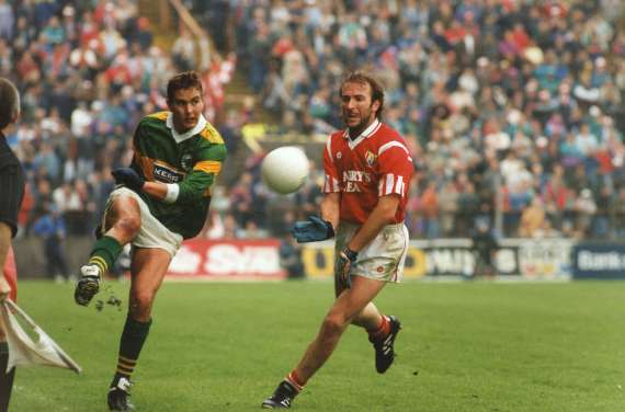 Maurice Fitzgerald in action against Brian Corcoran in a Munster Final