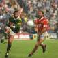 Maurice Fitzgerald in action against Brian Corcoran in a Munster Final