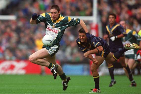 Darragh O Se in action with Chris Johnston in the 2002 Intl Rules Series