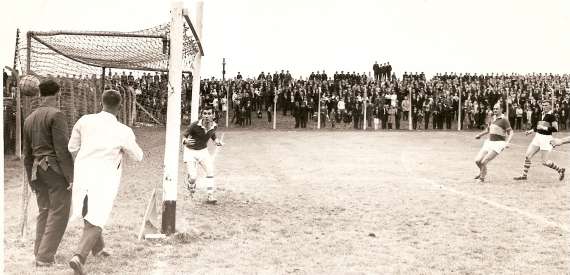 Niall Sheehy hammers the ball past Weeshie Fogarty in the 1966 County Final