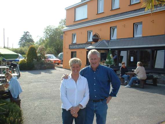 Rosarii and Pat Spillane outside their pub in Templenoe